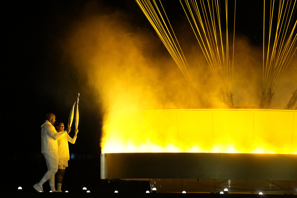 Paris glitters in the rain for ambitious Olympic opening ceremony The