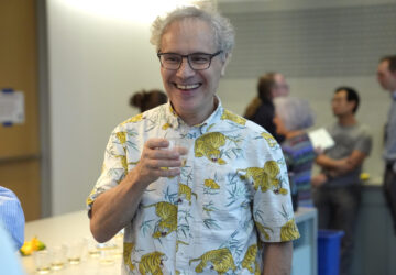 Victor Ambros, 2024 Nobel Prize winner in physiology or medicine, and professor of natural science at the University of Massachusetts Medical School, celebrates with colleagues, at the school, in Worcester, Mass. Monday, Oct. 7, 2024. (AP Photo/Steven Senne)