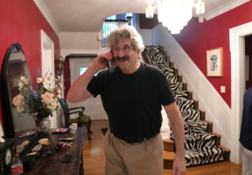 Gary Ruvkun, American molecular biologist, 2024 Nobel Prize winner in physiology or medicine, speaks on a phone, Monday, Oct. 7, 2024, at his home, in Newton, Mass. (AP Photo/Steven Senne)