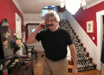 Gary Ruvkun, American molecular biologist, 2024 Nobel Prize winner in physiology or medicine, speaks on a phone, Monday, Oct. 7, 2024, at his home, in Newton, Mass. (AP Photo/Steven Senne)