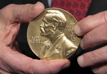 FILE - A close-up view of a Nobel Prize medal at the National Institutes of Health (NIH) in Bethesda, Md., Tuesday, Dec. 8, 2020. (AP Photo/Jacquelyn Martin, File)