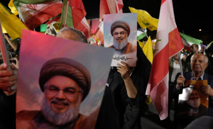 Iranian demonstrators hold posters of slain Hezbollah leader Hassan Nasrallah during an anti-Israeli protest at Felestin (Palestine) Square in Tehran, Iran, Tuesday, Oct. 1, 2024. (AP Photo/Vahid Salemi)