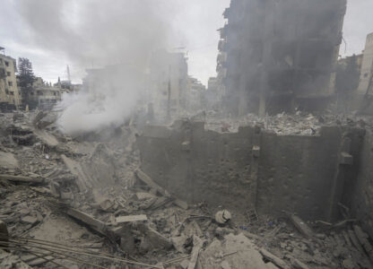 Smoke rises from destroyed buildings at the site of an Israeli airstrike hit in Choueifat, southeast of Beirut, Lebanon, Monday, Oct. 7, 2024. (AP Photo/Bilal Hussein)