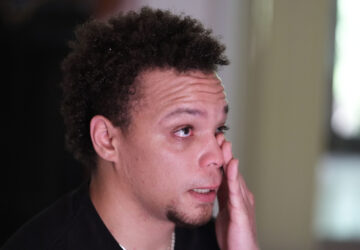 Lij Hacker wipes away a tear while talking about his late brother, Asson Hacker, during an interview in Bloomington, Ind., on June 4, 2024. (AP Photo/Darron Cummings)