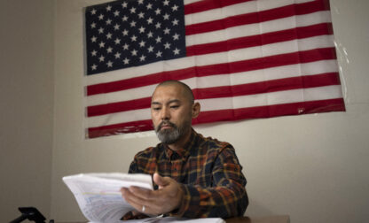 FILE - Chinese migrant Li Kai aka Khaled, an ethnic Hui Muslim, studies for a Commercial Driving License in his apartment in Flushing, New York, May 3, 2024. Li Kai came to the U.S. with his wife and two sons seeking religious freedom and a better life. (AP Photo/Serkan Gurbuz, File)