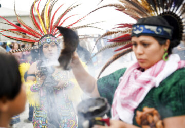 A performer burns charcoal during a ritual on Indigenous Peoples Day Monday, Oct. 14, 2024, in San Francisco. (AP Photo/Minh Connors)