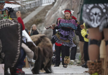 A dancer performs at the Indigenous Peoples Day Sunrise Gathering on Monday, Oct. 14, 2024, in San Francisco. (AP Photo/Minh Connors)