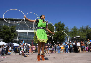 FILE - Performers from the Native American Hoop Dance of Ballet Arizona dance at an Indigenous Peoples Day festival, Oct. 9, 2023, in Phoenix. (AP Photo/Ross D. Franklin, File)