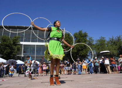 FILE - Performers from the Native American Hoop Dance of Ballet Arizona dance at an Indigenous Peoples Day festival, Oct. 9, 2023, in Phoenix. (AP Photo/Ross D. Franklin, File)