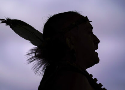 FILE - Tatanka Gibson of the Haliwa-Saponi/Nansemond Tribal Nations leads attendees in song and dance during a gathering marking Indigenous Peoples Day at Penn Treaty Park, Oct. 11, 2021, in Philadelphia. (AP Photo/Matt Rourke, File)