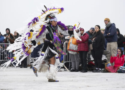 Tank Young, 14, performs at the Indigenous Peoples Day Sunrise Gathering on Monday, Oct. 14, 2024, in San Francisco. (AP Photo/Minh Connors)