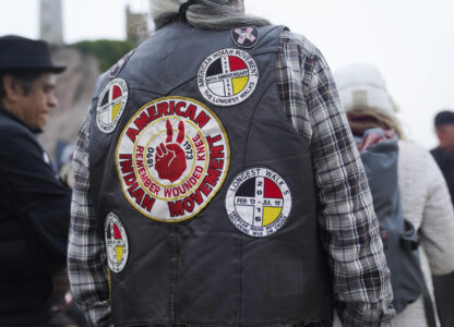 A man wears a vest in support of the American Indian Movement on Indigenous Peoples Day Monday, Oct. 14, 2024, in San Francisco. (AP Photo/Minh Connors)