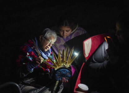 Teacher Irma Pineda teaches Amayah Lara-Ponce in putting together a capilli on Indigenous Peoples Day Monday, Oct. 14, 2024, in San Francisco. (AP Photo/Minh Connors)