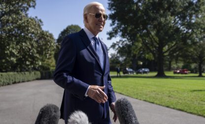 President Joe Biden speaks to the media before boarding Marine One on the South Lawn of the White House in Washington, Saturday, Oct. 5, 2024. (AP Photo/Ben Curtis)