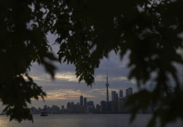 The Toronto skyline is seen from Wards Island in Toronto on Thursday, Sept. 19, 2024. (AP Photo/Angie Wang)