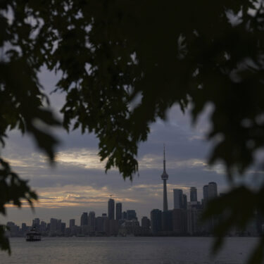 The Toronto skyline is seen from Wards Island in Toronto on Thursday, Sept. 19, 2024. (AP Photo/Angie Wang)