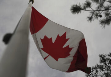 The Canadian flag is blown by wind on Centre Island in Toronto on Thursday, Sept. 19, 2024. (AP Photo/Angie Wang)