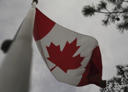 The Canadian flag is blown by wind on Centre Island in Toronto on Thursday, Sept. 19, 2024. (AP Photo/Angie Wang)