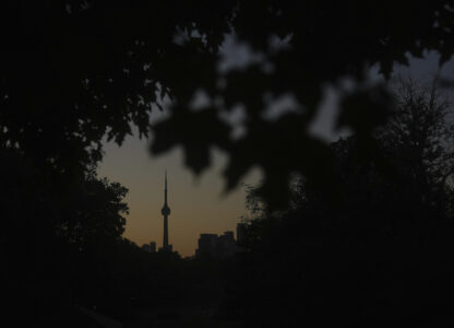 The CN Tower is seen from Trinity Bellwoods Park in Toronto on Wednesday, Sept. 18, 2024. (AP Photo/Angie Wang)