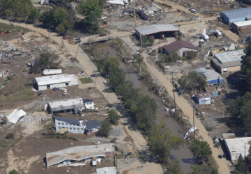 FILE - A view of damage in Asheville, N.C., is seen during an aerial tour with President Joe Biden who looked at areas impacted by Hurricane Helene near Asheville, N.C., Wednesday, Oct. 2, 2024. (AP Photo/Susan Walsh, File)