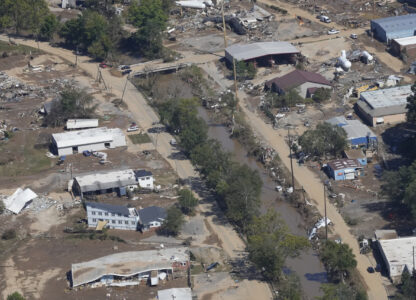 FILE - A view of damage in Asheville, N.C., is seen during an aerial tour with President Joe Biden who looked at areas impacted by Hurricane Helene near Asheville, N.C., Wednesday, Oct. 2, 2024. (AP Photo/Susan Walsh, File)