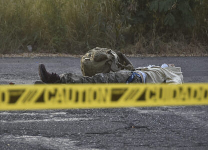 Caution tape surrounds a body lying on the street Culiacan, Sinaloa state, Mexico, Monday, Oct. 14, 2024. (AP Photo)