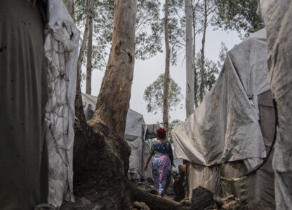 Nelly Shukuru, 51, who had planned hanging herself, walks in the Lushagala camp in Goma, Democratic Republic of the Congo, Tuesday, Aug. 27, 2024. (AP Photo/Moses Sawasawa)