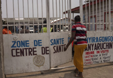 Eveline, 22 , walks to a health center seeking mental counselling in Goma, Democratic republic of the Congo, Monday, Aug. 26, 2024. (AP Photo/Moses Sawasawa)