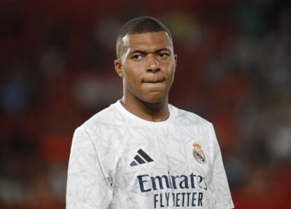 FILE - Real Madrid's Kylian Mbappe looks on before the start of a Spanish La Liga soccer match between Mallorca and Real Madrid at the Son Moix Stadium in Palma de Mallorca, Spain, Sunday, Aug. 18, 2024. (AP Photo/Francisco Ubilla, File)