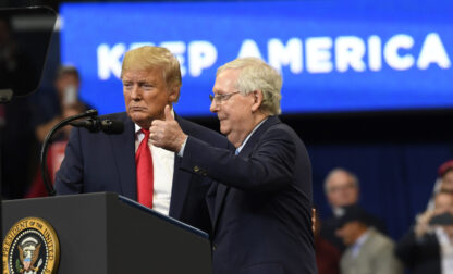 FILE - President Donald Trump brings Senate Majority Leader Mitch McConnell of Ky., on stage during a campaign rally in Lexington, Ky., Nov. 4, 2019. (AP Photo/Susan Walsh, File)