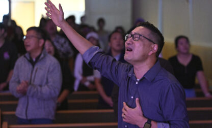 Pastor Owen Lee sings during a service at the Christ Central Presbyterian Church, Sunday, Oct. 13, 2024 in Centreville. (AP Photo/John McDonnell)