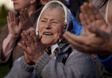 Supporters of Renato Usatii, leader of the Our Party and presidential candidate, applaud him during a rally on the final day of electoral campaign in Chisinau, Moldova, Friday, Oct. 18, 2024, ahead of a presidential election and a referendum on whether to enshrine in Moldova's Constitution its path to European Union membership that will take place on Oct. 20. (AP Photo/Vadim Ghirda)