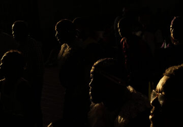 Pilgrims arrive inside San Felipe Church to honor the Black Christ in Portobelo, Panama, early Monday, Oct. 21, 2024, during a festival celebrating the iconic statue that was found on the shore in 1658. (AP Photo/Matias Delacroix)