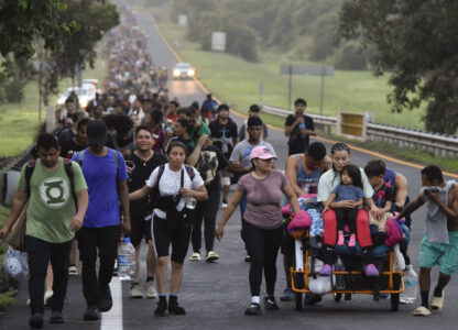 Migrants walk along the Huixtla highway in the state of Chiapas, Mexico, Tuesday, Oct. 22, 2024, hoping to reach the country's northern border and ultimately the United States. (AP Photo/Edgar H. Clemente)