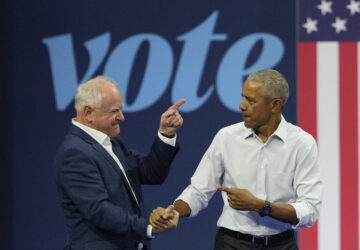 Democratic vice presidential nominee Minnesota Gov. Tim Walz, left, and former President Barack Obama shake hands at a campaign event Tuesday, Oct. 22, 2024, in Madison, Wis. (AP Photo/Morry Gash)