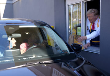 Republican presidential nominee former President Donald Trump hands an order to a customer at a drive-thru window during a campaign stop at a McDonald's, Sunday, Oct. 20, 2024, in Feasterville-Trevose, Pa. (AP Photo/Evan Vucci)