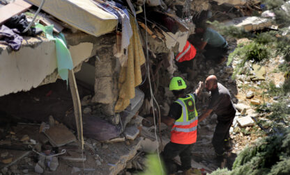 Rescuers look for survivors under the rubble of a destroyed building that was hit on Sept. 29 during the deadliest Israeli airstrike on the first week of escalation between Israel and Hezbollah where more than 70 people were killed, in Ain el Delb neighbourhood outside the Lebanese coastal city of Sidon, Monday, Sept. 30, 2024.(AP Photo/Mohammed Zaatari)