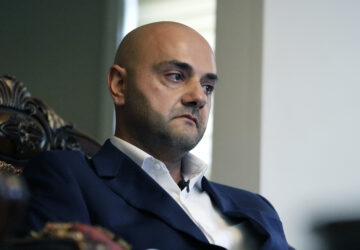 Assad Turfe, a Lebanese American and the deputy executive of Wayne County, recalls the detainment of his wife, during an interview, Oct. 23, 2024 in Dearborn, Mich. Turfe is among the few Arab American leaders in Michigan to have endorsed presidential candidate Kamala Harris. (AP Photo/Carlos Osorio)