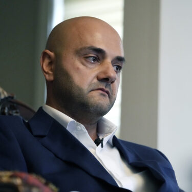 Assad Turfe, a Lebanese American and the deputy executive of Wayne County, recalls the detainment of his wife, during an interview, Oct. 23, 2024 in Dearborn, Mich. Turfe is among the few Arab American leaders in Michigan to have endorsed presidential candidate Kamala Harris. (AP Photo/Carlos Osorio)