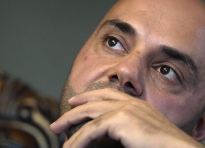 Assad Turfe, a Lebanese American and the deputy executive of Wayne County, recalls the detainment of his wife, during an interview, Oct. 23, 2024 in Dearborn, Mich. Turfe is among the few Arab American leaders in Michigan to have endorsed presidential candidate Kamala Harris. (AP Photo/Carlos Osorio)