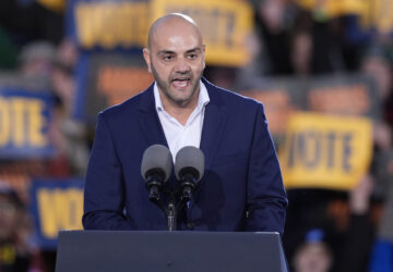 Assad Turfe, of Dearborn, Mich., speaks at a campaign rally for Democratic presidential nominee Vice President Kamala Harris at Burns Park in Ann Arbor, Mich., Monday, Oct. 28, 2024. (AP Photo/Carlos Osorio)