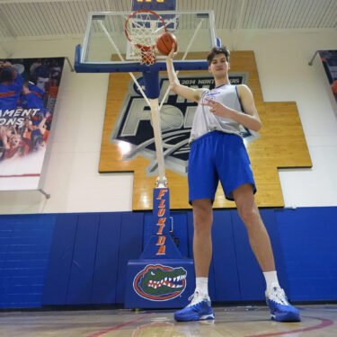 Olivier Rioux, 7-foot-9 NCAA college basketball player at Florida, poses for a photo after practice, Friday, Oct. 18, 2024, in Gainesville, Fla. (AP Photo/John Raoux)