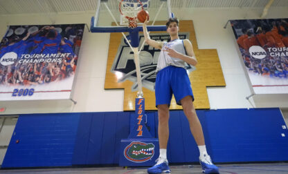 Olivier Rioux, 7-foot-9 NCAA college basketball player at Florida, poses for a photo after practice, Friday, Oct. 18, 2024, in Gainesville, Fla. (AP Photo/John Raoux)