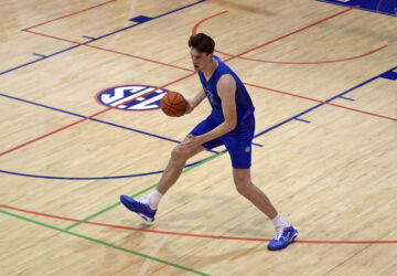 Olivier Rioux, 7-foot-4 NCAA college basketball player from Florida, moves the ball downhill during the team's practice, Friday, Oct. 18, 2024, in Gainesville, Florida. (AP Photo/John Raoux)