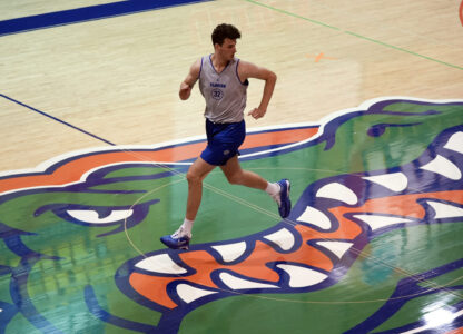 Olivier Rioux, 7-foot-4 NCAA college basketball player at Florida, leads the court during the team's practice, Friday, Oct. 18, 2024, in Gainesville, Florida. (AP Photo/John Raoux)