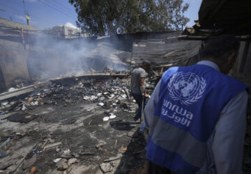 FILE - Palestinians look at the destruction after an Israeli strike on a school run by UNRWA, the U.N. agency helping Palestinian refugees, in Nuseirat, Gaza Strip, May 14, 2024. (AP Photo/Abdel Kareem Hana, File)