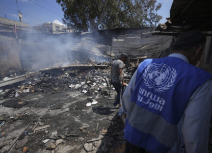 FILE - Palestinians look at the destruction after an Israeli strike on a school run by UNRWA, the U.N. agency helping Palestinian refugees, in Nuseirat, Gaza Strip, May 14, 2024. (AP Photo/Abdel Kareem Hana, File)