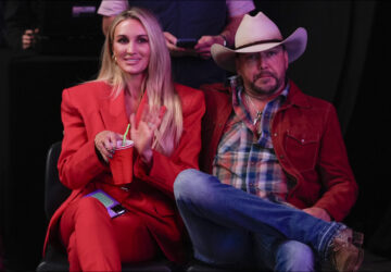 Brittany and Jason Aldean listen as Republican presidential nominee former President Donald Trump speaks at a Turning Point Action campaign rally, Wednesday, Oct. 23, 2024, in Duluth, Ga. (AP Photo/Alex Brandon)