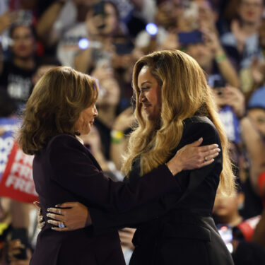 Musical artist Beyonce, right, and Democratic presidential nominee Vice President Kamala Harris, left, embrace on stage during a campaign rally Friday, Oct. 25, 2024, in Houston. (AP Photo/Annie Mulligan)