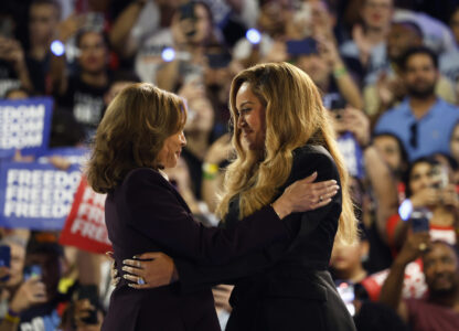 Musical artist Beyonce, right, and Democratic presidential nominee Vice President Kamala Harris, left, embrace on stage during a campaign rally Friday, Oct. 25, 2024, in Houston. (AP Photo/Annie Mulligan)